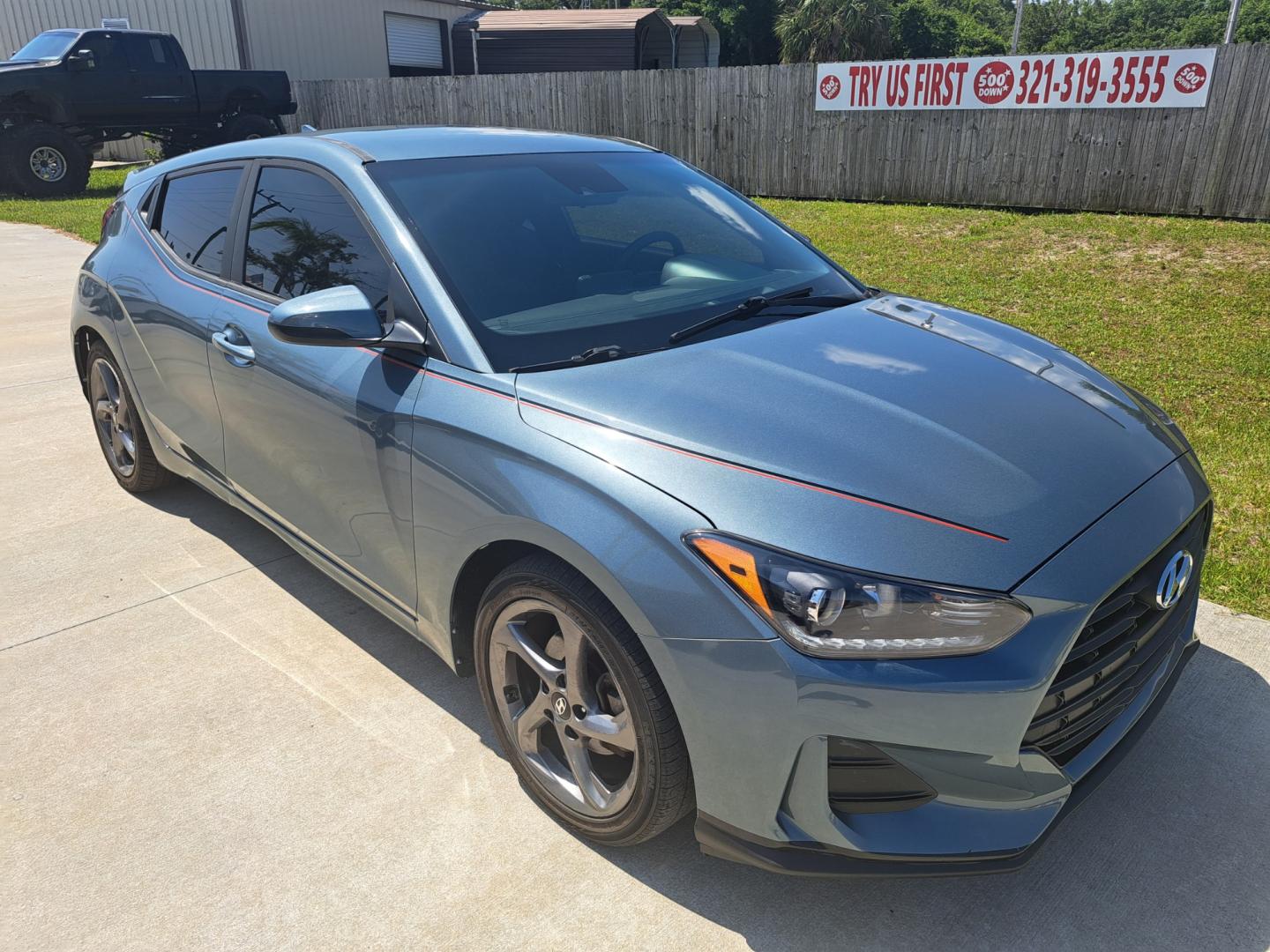 2019 Grey Hyundai Veloster 2.0 6A (KMHTG6AFXKU) with an 2.0L L4 DOHC 16V engine, 6A transmission, located at 1181 Aurora Rd, Melbourne, FL, 32935, (321) 241-1100, 28.132914, -80.639175 - Photo#2